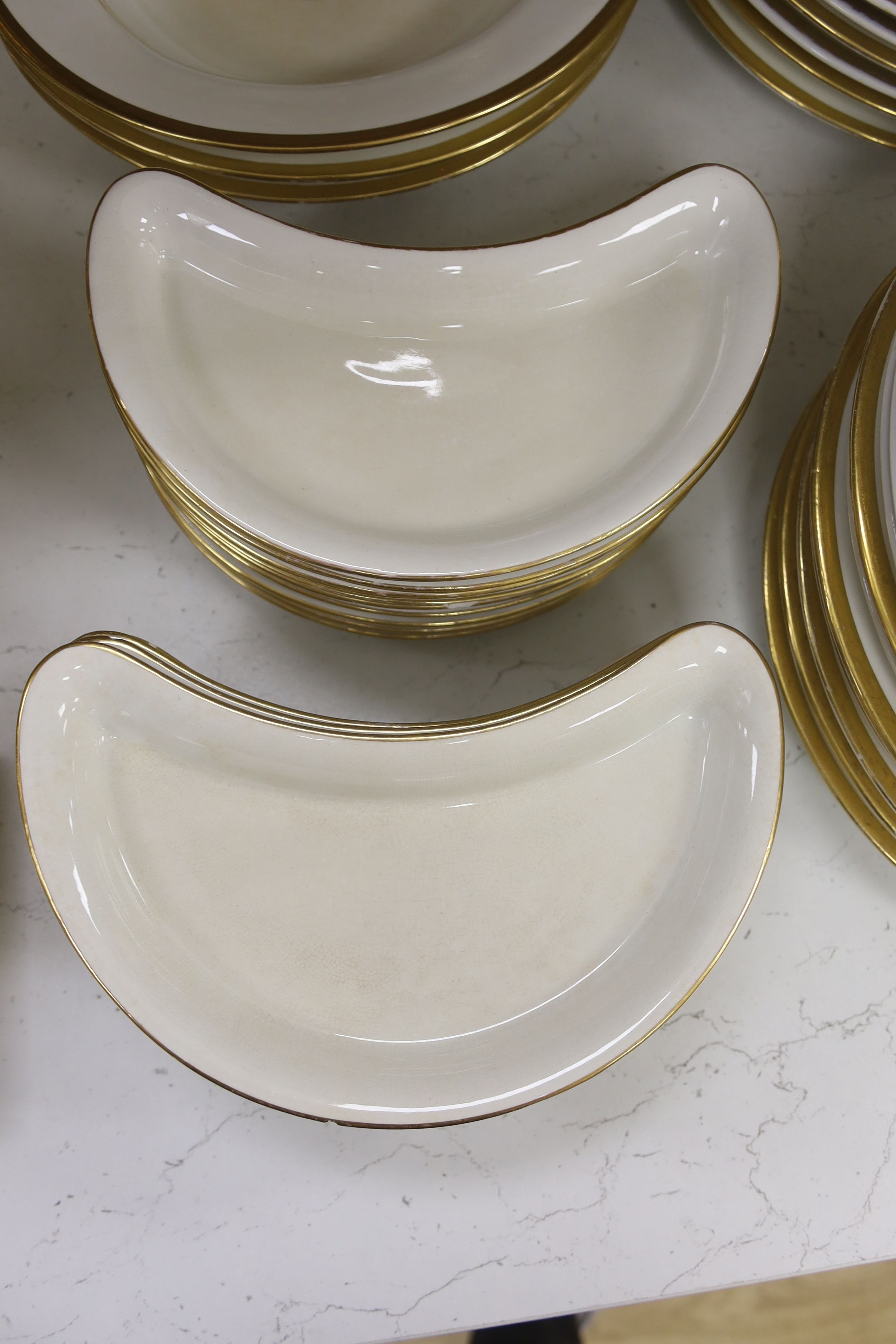 An early 19th century crested part dinner service, by Chamberlains Worcester, and another similar service